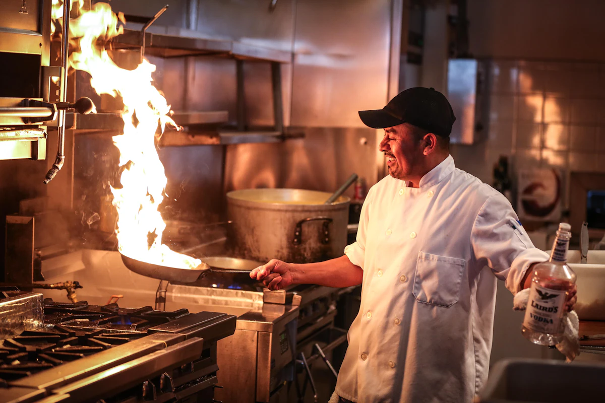 Chef cooking over a flame