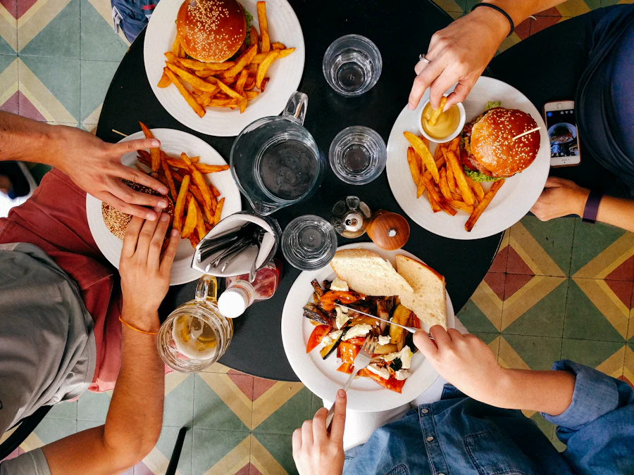 Friends sharing burgers and fries